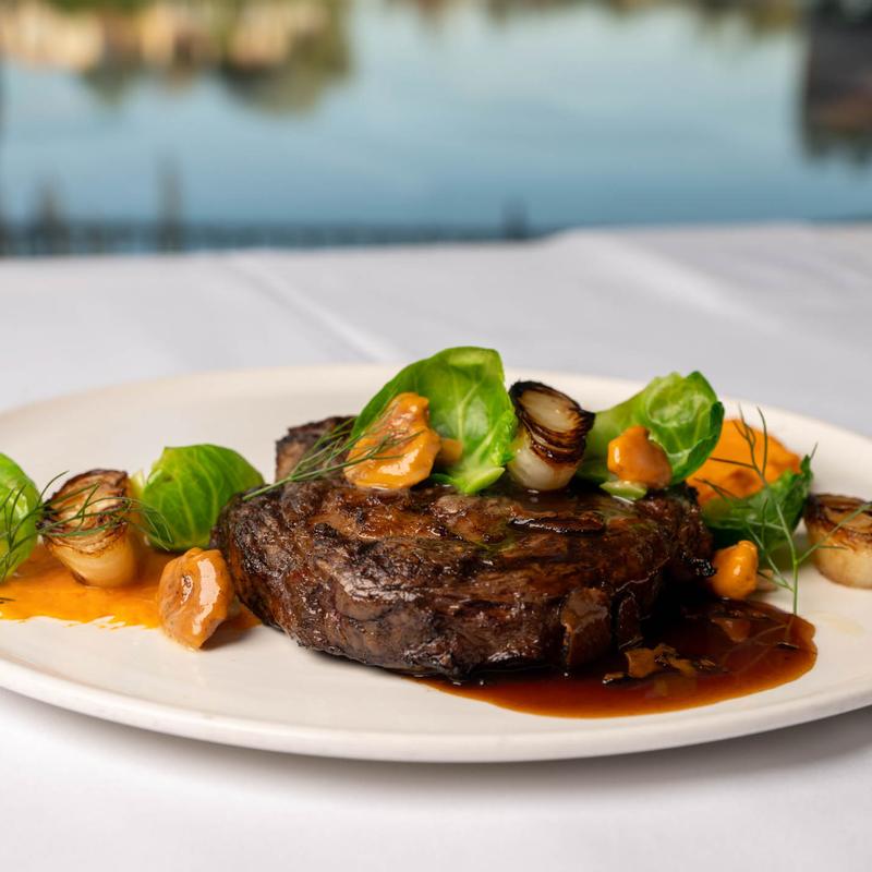 Steak with lakeside view at Americana