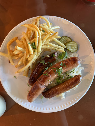 Bratwurst with fries and sauerkraut at Bites of Europe